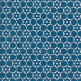 Wallpaper in a floral lattice print in cream on a indigo blue field.