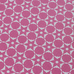 Wallpaper detail in a floral lattice print in cream on a magenta field.