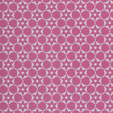 Wallpaper in a floral lattice print in cream on a magenta field.