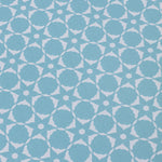 Wallpaper detail in a floral lattice print in  cream on a powder blue field.