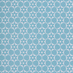 Wallpaper in a floral lattice print in  cream on a powder blue field.
