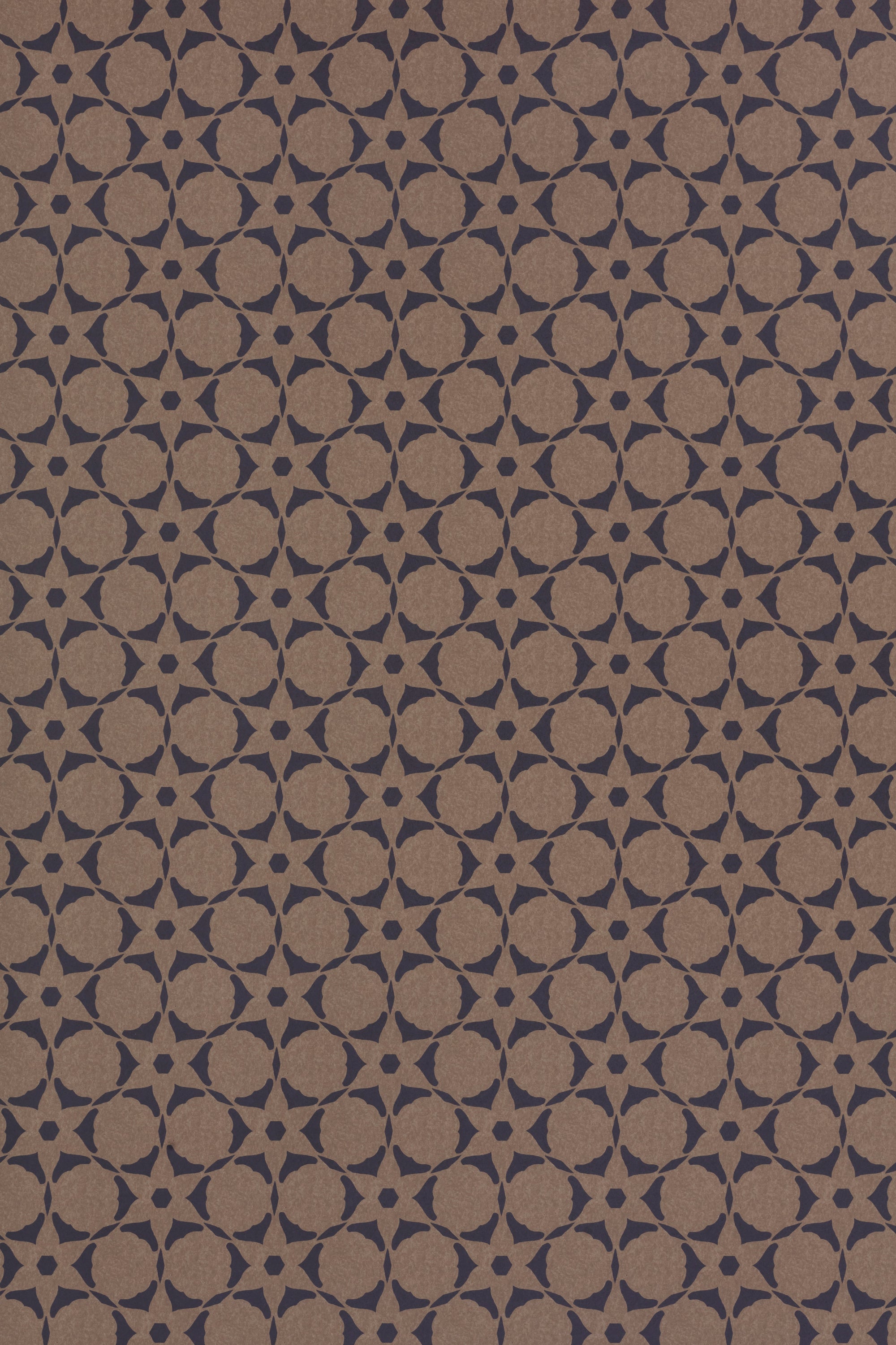 Wallpaper in a floral lattice print in navy on a kraft brown field