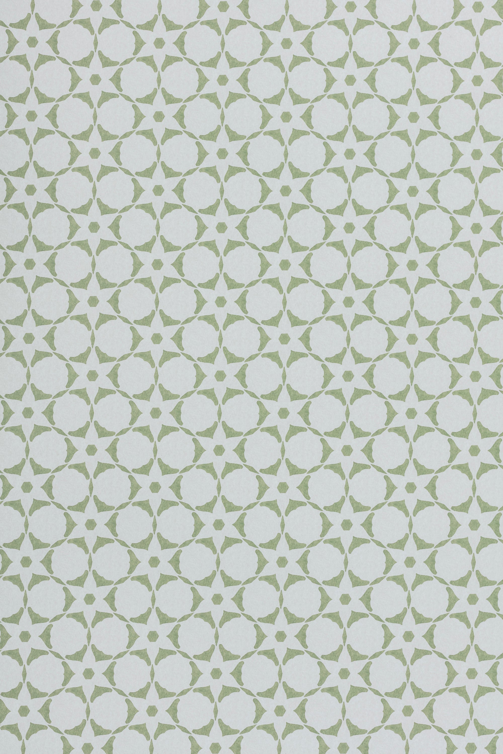 Wallpaper in a floral lattice print in  cream on a jade green field.