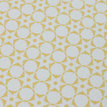 Wallpaper detail in a floral lattice print in  yellow on a cream field