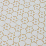 Detail of a wallpaper in a floral lattice print in tan on a cream field.