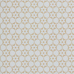 Wallpaper in a floral lattice print in tan on a cream field.