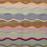 Multicolored wavy patterned rug with various colors.