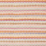 Patterned rug with wavy lines in various colors on a light background