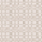 Detail of wallpaper in a large-scale checked pattern in shades of cream and tan.