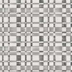 Detail of wallpaper in a large-scale checked pattern in shades of gray and white.