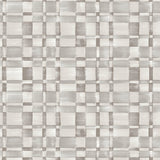 Detail of fabric in a large-scale checked pattern in shades of greige.