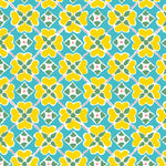 Detail of wallpaper in a floral lattice print in yellow, pink, blue and white.