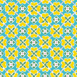 Detail of wallpaper in a floral lattice print in yellow, pink, blue and white.