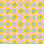 Detail of wallpaper in a floral lattice print in yellow, pink, green and white.