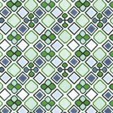 Detail of fabric in a geometric diamond and floral print in shades of green, purple and white.