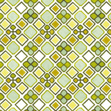 Detail of wallpaper in a geometric diamond and floral print in shades of green, yellow and white.