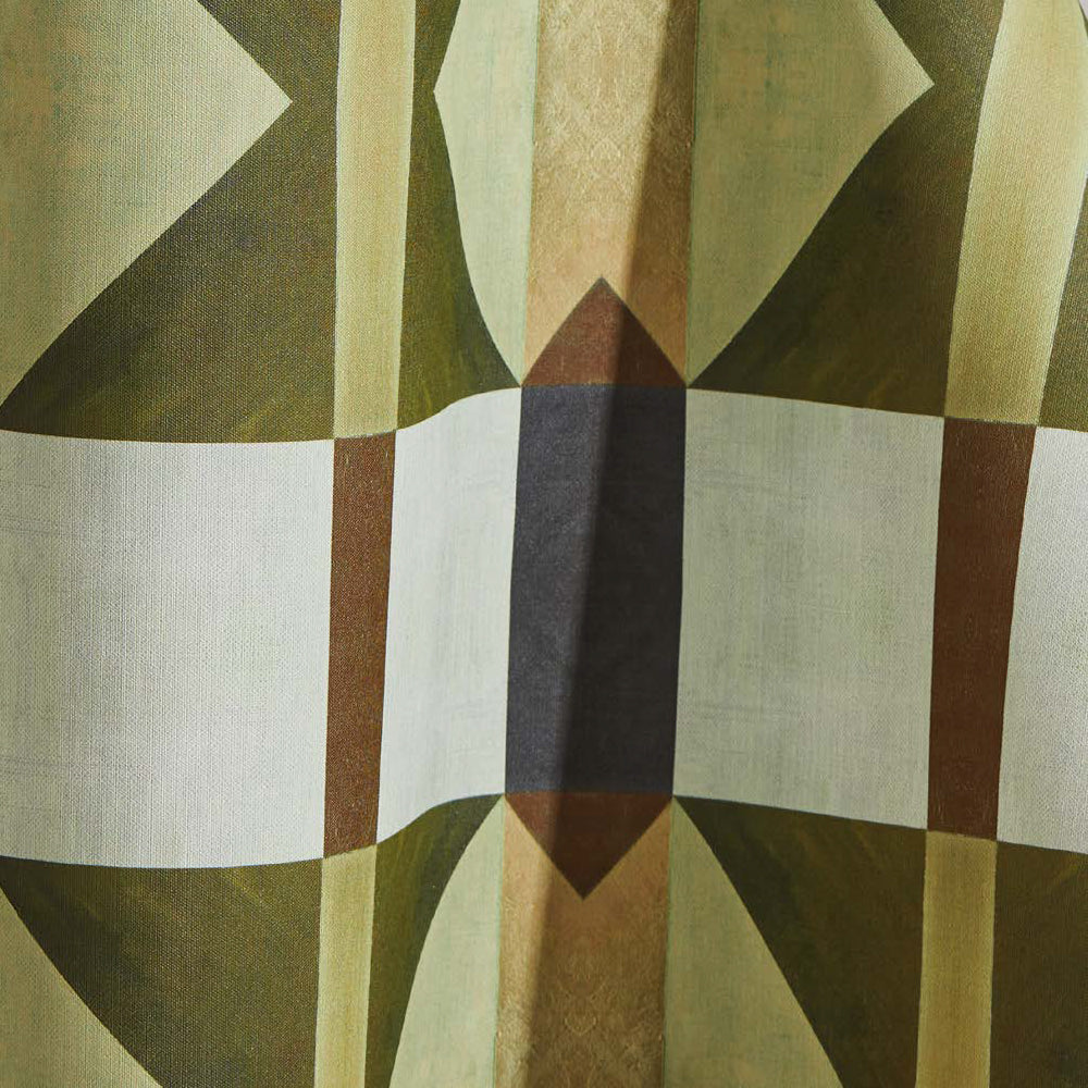 Draped wallpaper yardage in a geometric grid print in shades of green and brown on a cream field.