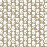 Detail of fabric in a classic floral silhouette print in cream on a brown field