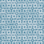 Detail of wallpaper in a gridded damask print in white on a blue field.