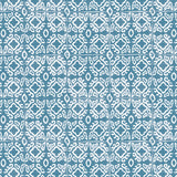 Detail of wallpaper in a gridded damask print in white on a blue field.