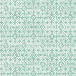 Detail of wallpaper in a gridded damask print in white on a teal field.