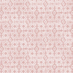 Detail of wallpaper in a gridded damask print in white on a light pink field.