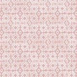 Detail of wallpaper in a gridded damask print in white on a light pink field.