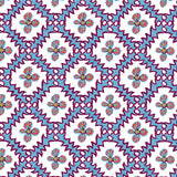 Detail of wallpaper in a playful floral grid print in blue, pink and purple on a white field.