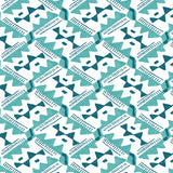 Detail of wallpaper in painterly diamond print in blue and turquoise on a white field.