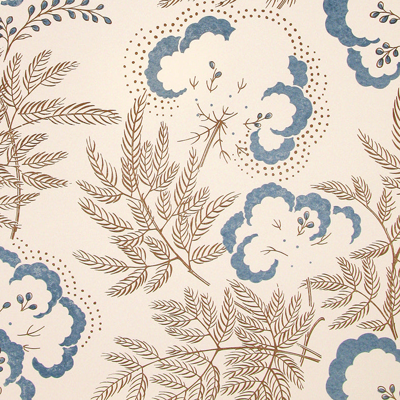 Detail of wallpaper in an intricate floral print in blue and chocolate brown on a cream field.