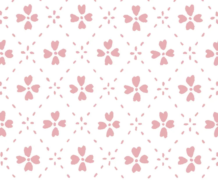 Detail of wallpaper in a dainty floral lattice print in light pink on a white field.