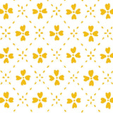 Detail of wallpaper in a dainty floral lattice print in mustard on a white field.