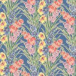 Detail of fabric in a large-scale floral pattern in a rainbow of pastels on a blue field.