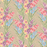 Detail of fabric in a large-scale floral pattern in a rainbow of pastels on a tan field.