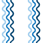 Detail of fabric in a wavy stripe print in blue and navy on a white field.