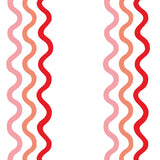 Detail of wallpaper in a wavy stripe print in pink and red on a white field.