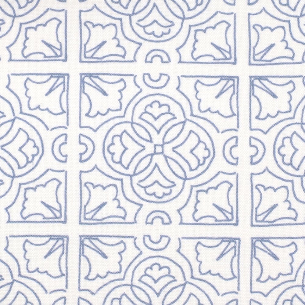 Detail of fabric in a damask lattice print in blue on a white field.