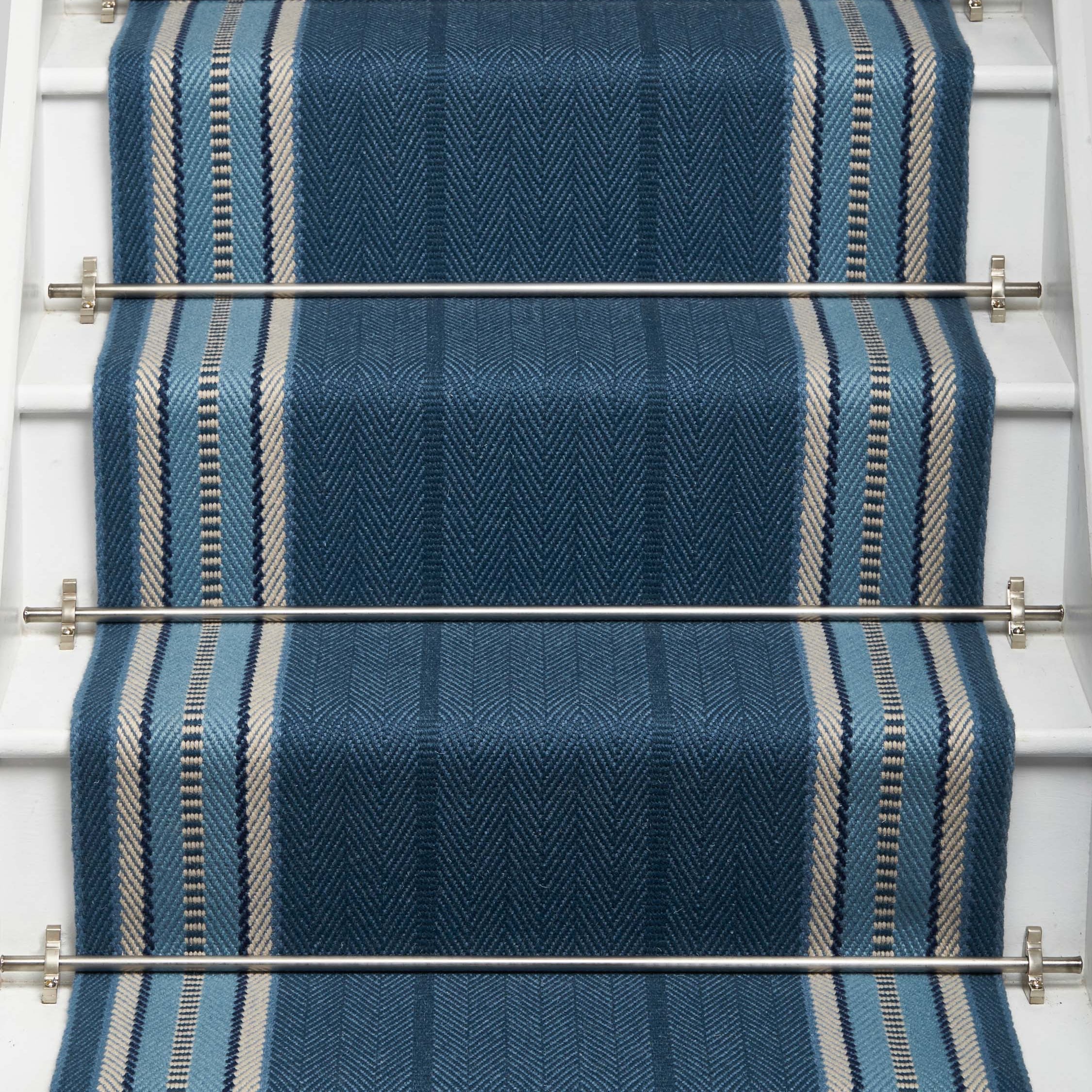 Striped flatweave runner in blue and grey on white staircase