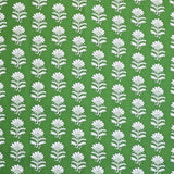 Detail of fabric in a repeating thistle print in white and green on a green field.