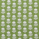 Detail of fabric in a repeating thistle print in white and green on a green field.