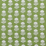 Detail of fabric in a repeating thistle print in white and green on a green field.