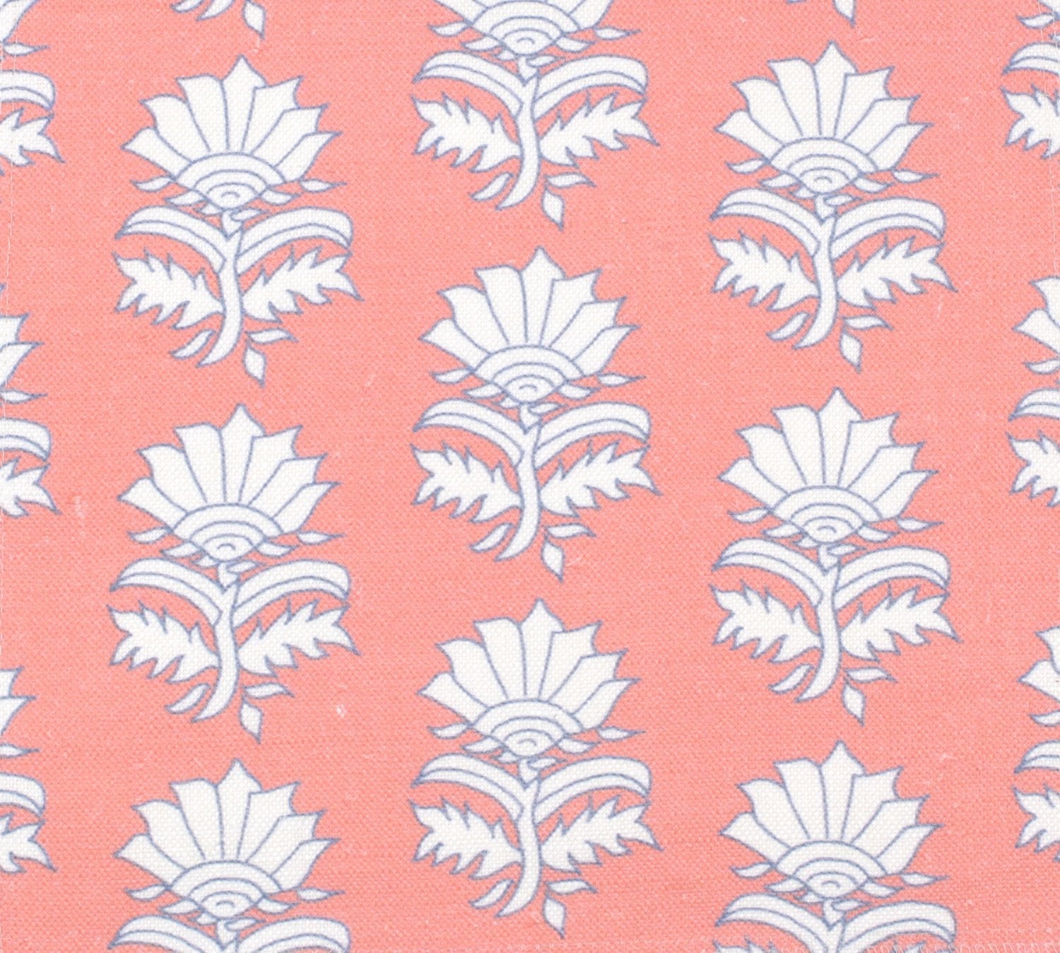 Detail of fabric in a repeating thistle print in white and blue on a pink field.