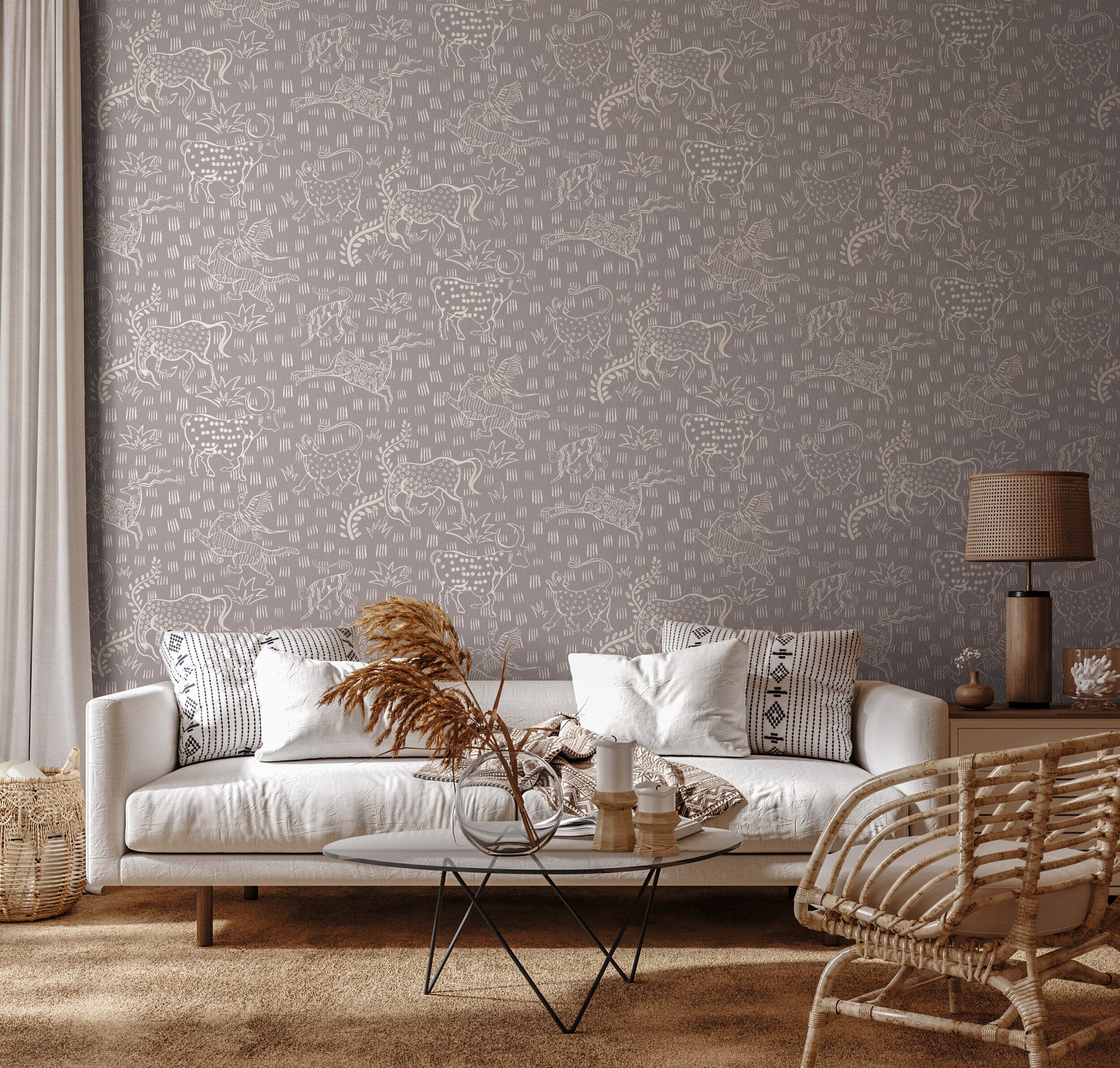 A livingroom furnished in neutral midcentury furniture with a wall papered in a playful animal print in white and gray.