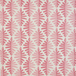 Detail of fabric in a fern leaf print in shades of pink on a white field.