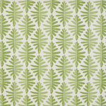 Detail of fabric in a fern leaf print in shades of green on a white field.