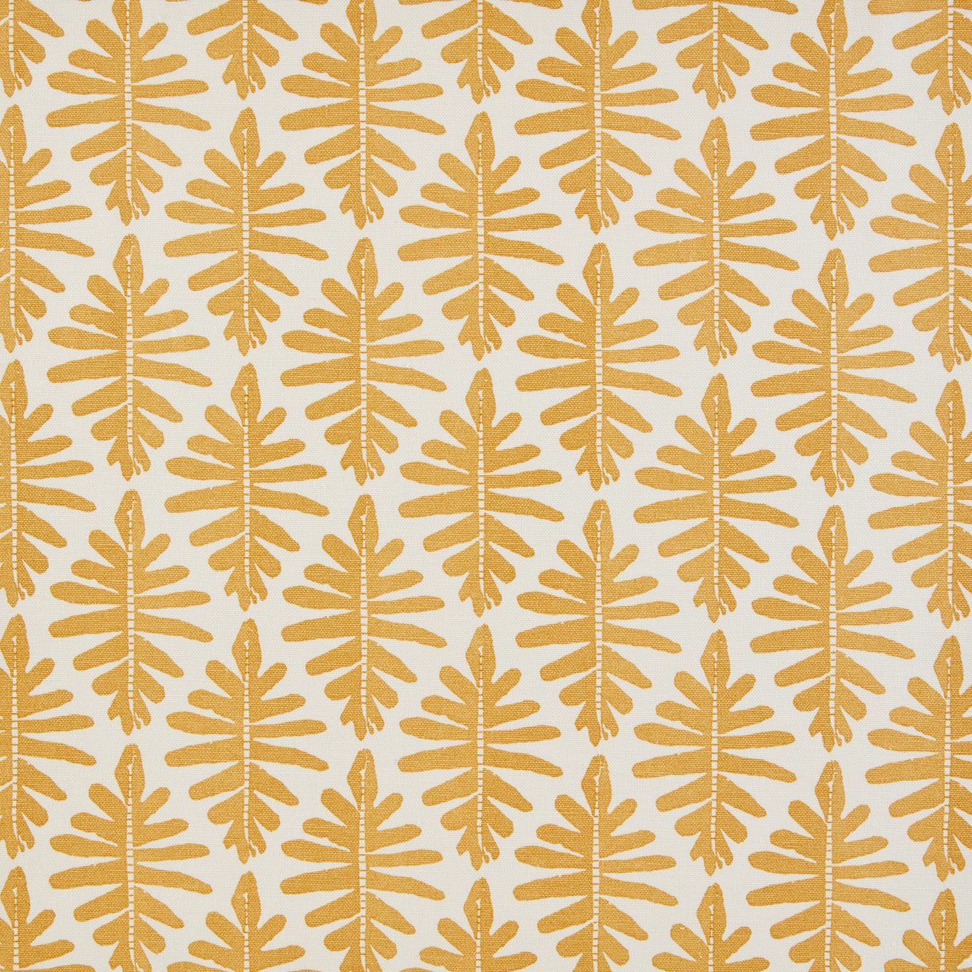 Detail of fabric in a fern leaf print in mustard on a white field.