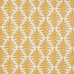 Detail of fabric in a fern leaf print in mustard on a white field.