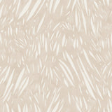 Detail of fabric in an abstract leaf pattern in white on a cream watercolor field.