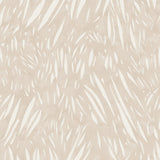 Detail of wallpaper in an abstract leaf pattern in white on a cream watercolor field.