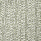 Detail of a linen fabric in a detailed geometric pattern in white on a light green field.